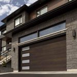 Wood panelled modern garage door with window down one side