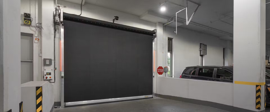 Industrial high-speed rubber door with breakaway technology, designed to survive impacts and reduce maintenance downtime in busy warehouses.