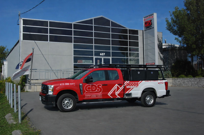 CDS Commercial Door Systems service truck parked in front of the Kingston showroom at 637 Gardiners Rd.