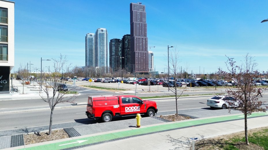 Dodds Garage Doors branded service truck parked in a commercial area of Vaughan near VMC towers for business garage door service.
