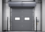 Commercial sectional garage door featuring a high-performance overhead air curtain for energy savings.