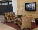 Interior view of Dodds Garage Doors showroom in Kingston showing comfortable seating and digital product displays.