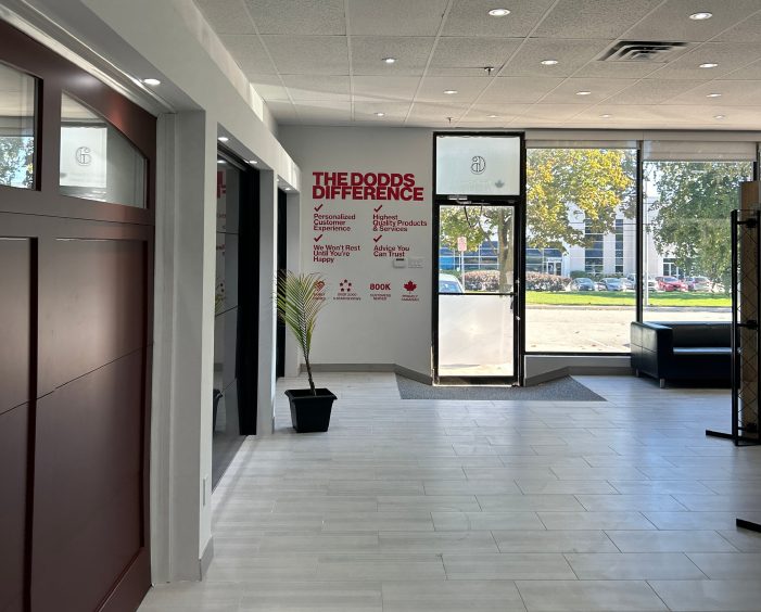 Inside the Dodds Garage Doors showroom featuring modern garage door designs and local service information.