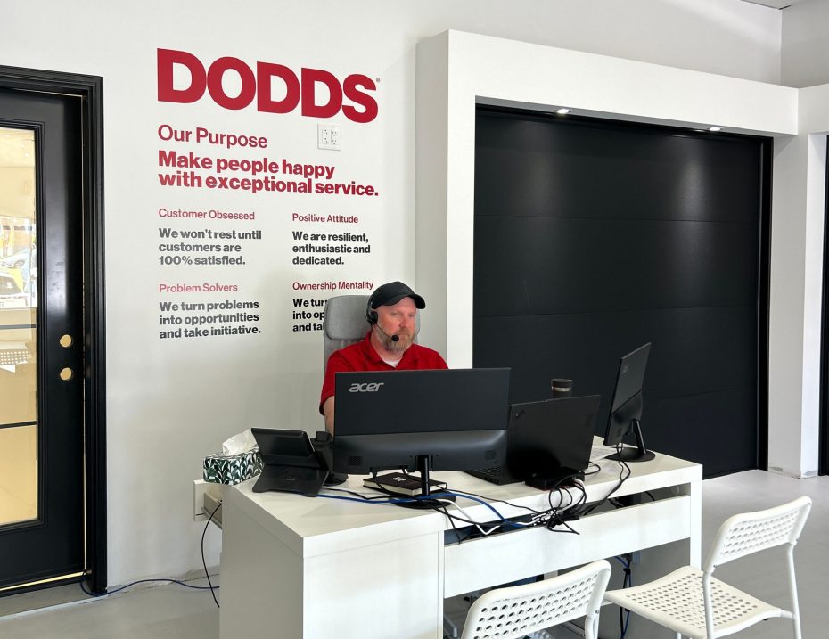 Rows of high-quality residential garage door styles and color choices inside the new Whitby showroom location.