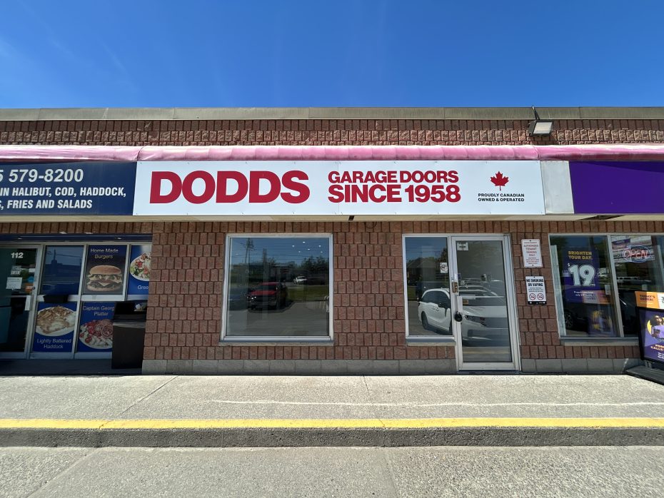Storefront exterior and official signage for Dodds Garage Doors showroom located at 1910 Dundas Street East in Whitby.