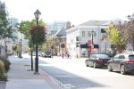 Vibrant downtown Burlington, Ontario streetscape featuring local shops and boutiques near Village Square.