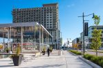 The Pride of Place carousel in downtown Markham near retail shops and residential garage door service areas.
