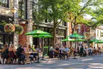 People enjoying outdoor dining on the patio of The Common Stove restaurant on Mississaga Street West in Orillia.
