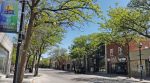 A sunny morning on in downtown Orillia, Ontario, showing local businesses and the Shop Downtown Orillia banner.