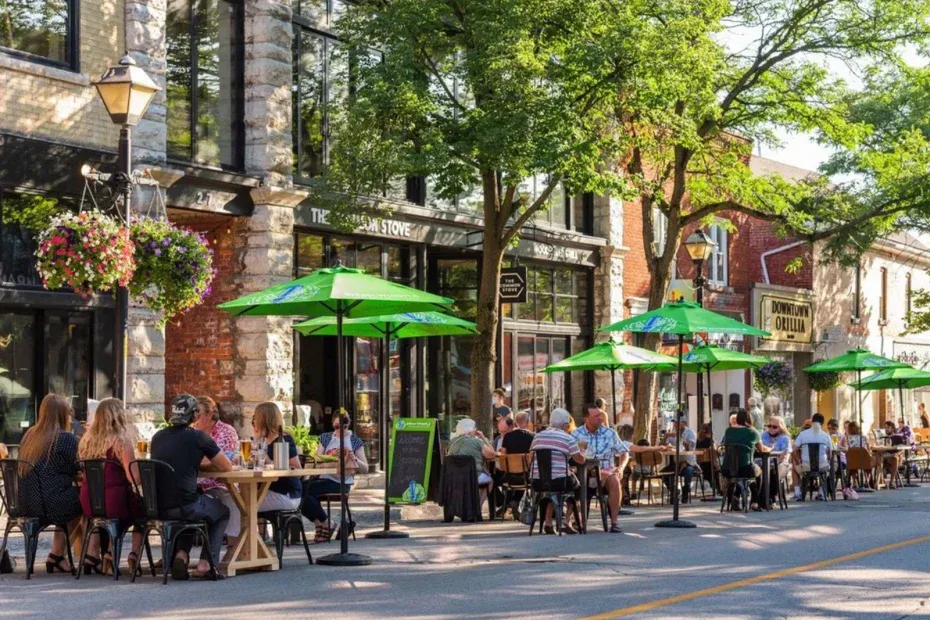 People enjoying outdoor dining on the patio of The Common Stove restaurant on Mississaga Street West in Orillia.