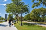 Local Etobicoke resident walking a dog along the waterfront path, representing the community served by Dodds Garage Doors.