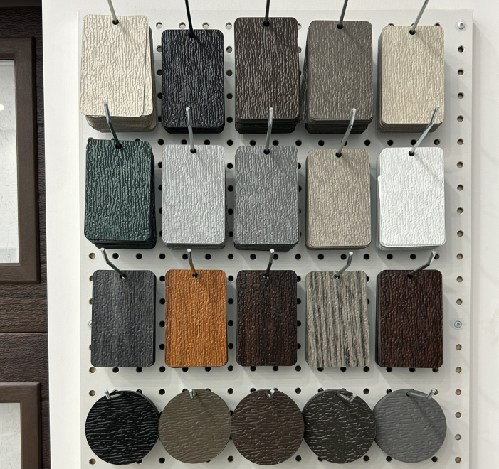 A display of various garage door color swatches and textures available for homeowners in Oshawa.