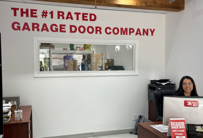 A garage door specialist helping a Barrie homeowner select a custom door style for their home renovation.