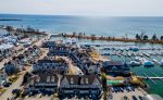 View of Pickering Nautical Village showing residential townhomes requiring specialized garage door maintenance.