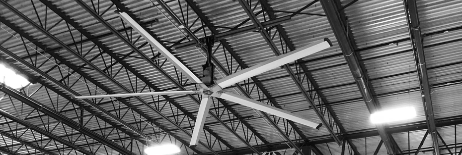 Wide-angle view of an HVLS warehouse fan system designed for large-scale air destratification and climate control.