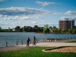 People cycling along the waterfront trail in Kingston, a community we proudly serve.