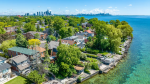 Luxury lakeside homes in the Long Branch neighborhood of Etobicoke featuring high-end residential garage door architecture.