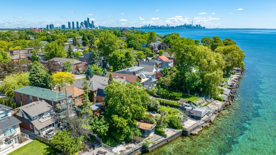 Luxury lakeside homes in the Long Branch neighborhood of Etobicoke featuring high-end residential garage door architecture.