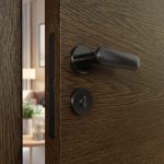 Close-up of a modern matte black lever handle and deadbolt on a wood-grain entry door.