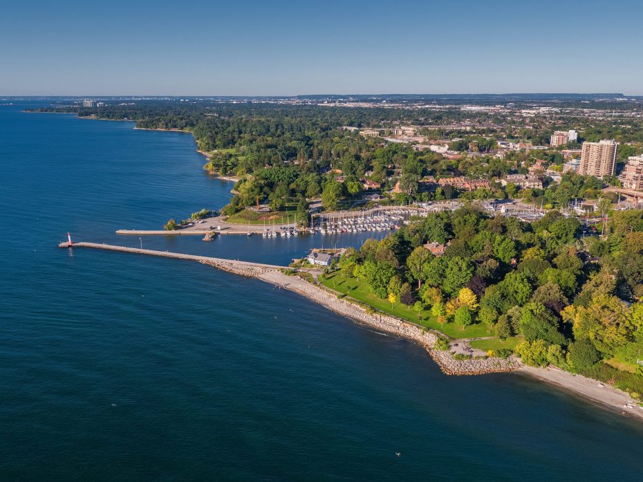 Aerial view of the Oakville harbor, lighthouse, and marina on a clear day.