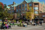 Pedestrians enjoying the lakeside shopping and cafe district in Oakville.