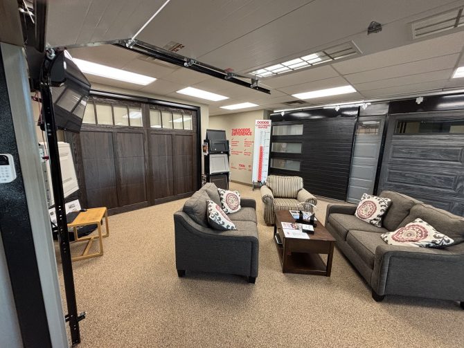 Wide view of the Dodds Cambridge showroom highlighting various overhead door styles and professional consultation area.