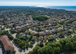 High-angle view of an Ajax residential community featuring homes with modern garage doors.