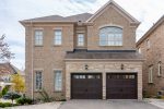 Professional residential garage door installation featuring two espresso brown double-layer steel doors.