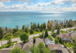 Drone shot of a residential neighborhood near the Scarborough Bluffs waterfront, highlighting local service coverage.