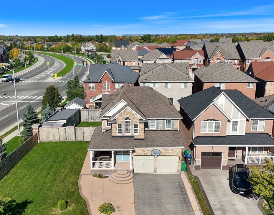 Modern suburban homes with double-car garage doors in a Bolton Ontario residential community.