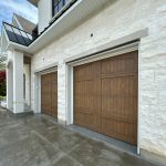 Detailed shot of a recessed wood overlay panel on a custom steel residential garage door.